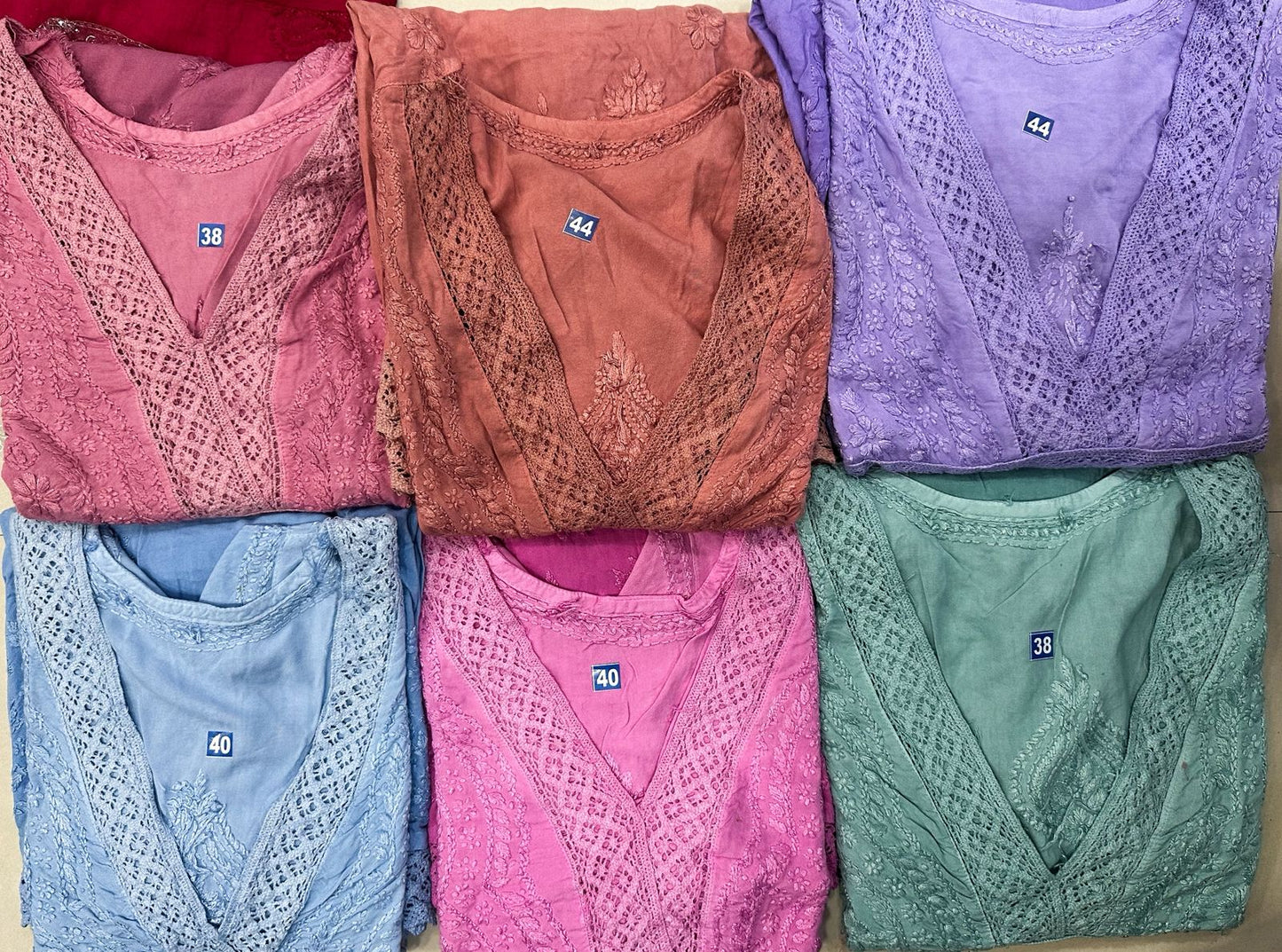 Rayon short dress/kurta with lace work.